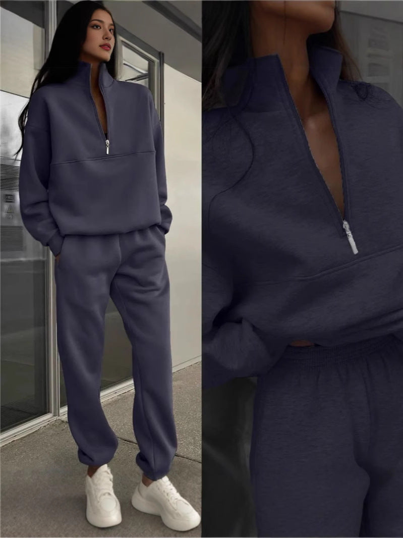 Navy blue zip-lapel two-piece tracksuit set with quarter-zip pullover and cuffed joggers