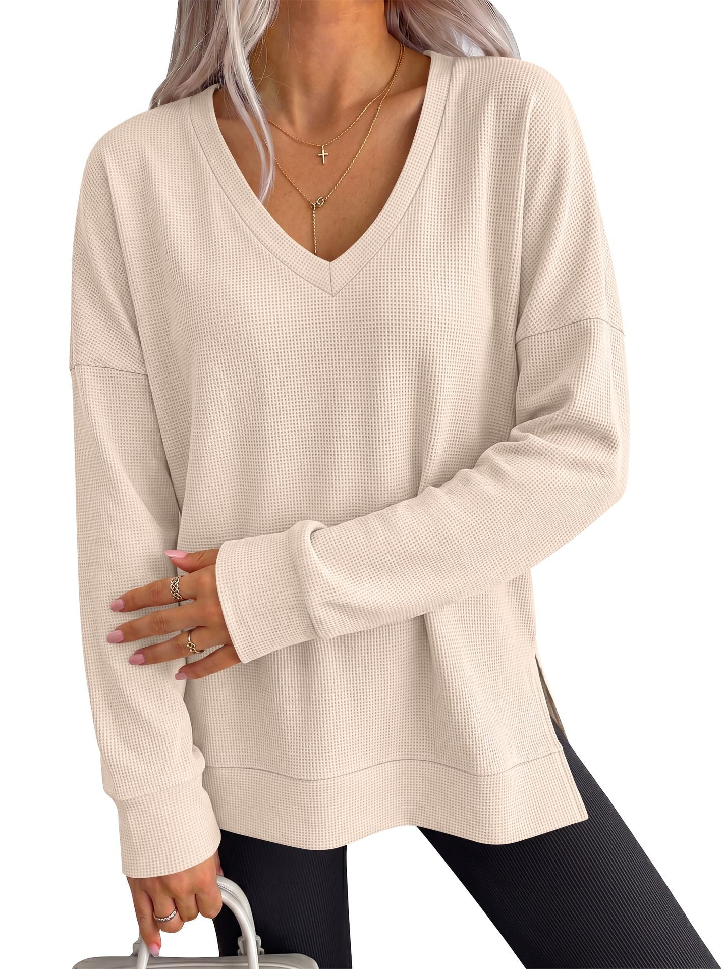 Women’s beige V-neck long-sleeve waffle knit loose T-shirt top with cuffed sleeves.