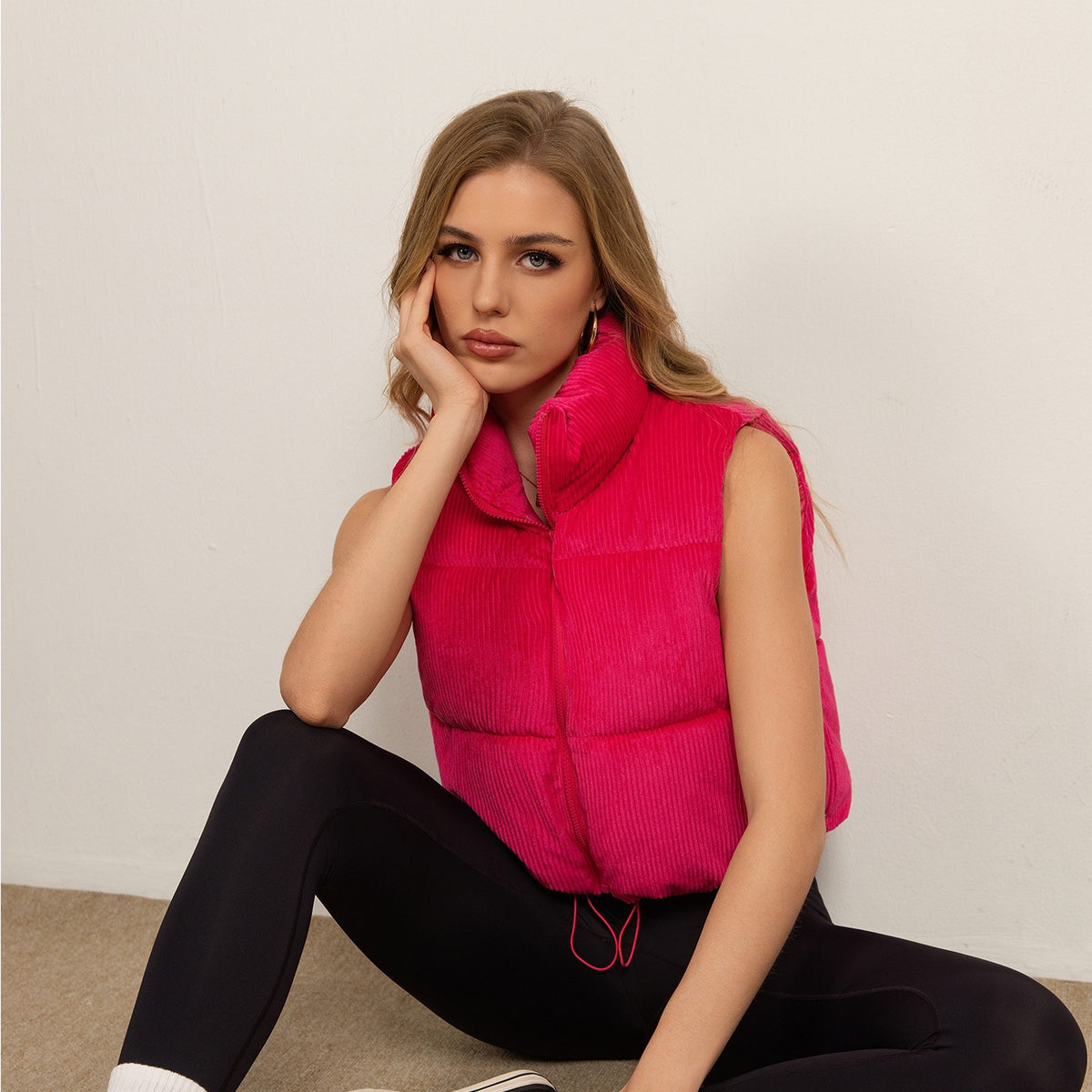 Women’s sleeveless hot pink quilted vest with stand collar and front zipper