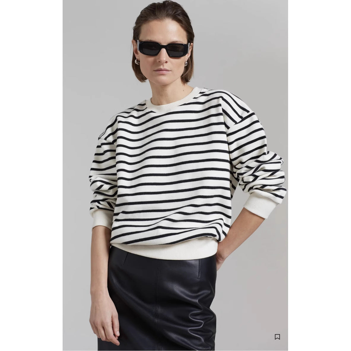 Black-and-white striped crew neck sweatshirt with dropped shoulders and ribbed hem