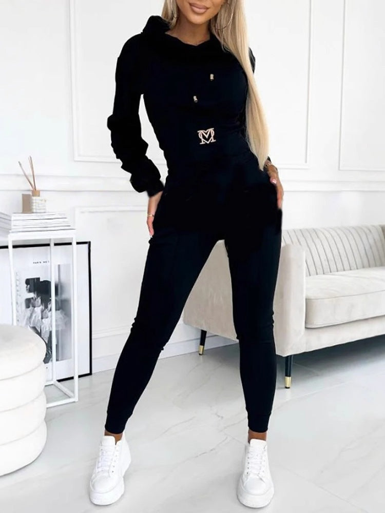 Black hooded top and long jogger pants set with drawstring waist and logo.