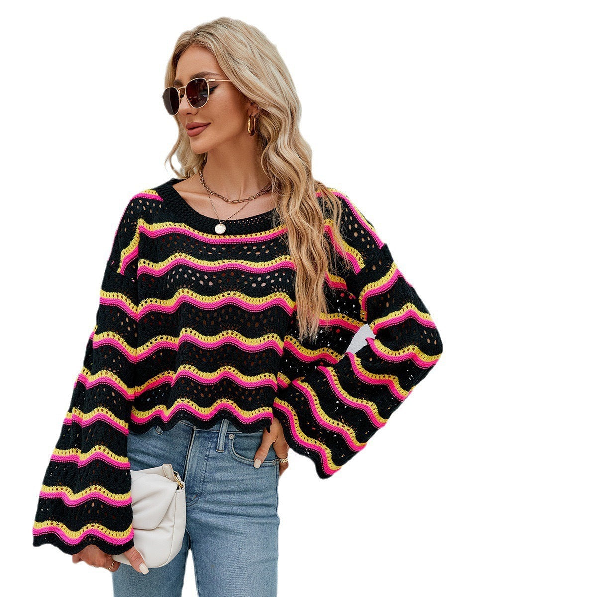 Women’s striped knit pullover sweater with long sleeves, crew neck; black with neon pink and yellow wavy stripes