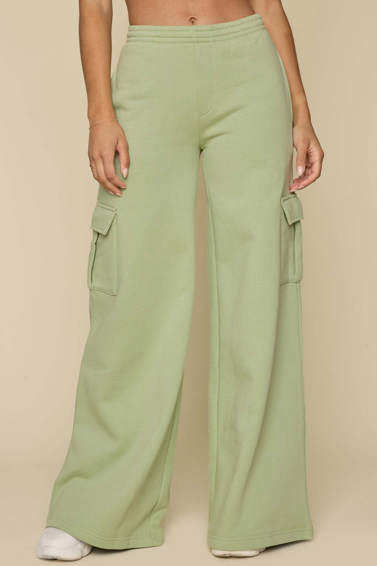Light green wide-leg cargo pants with elastic drawstring waist and cargo pockets