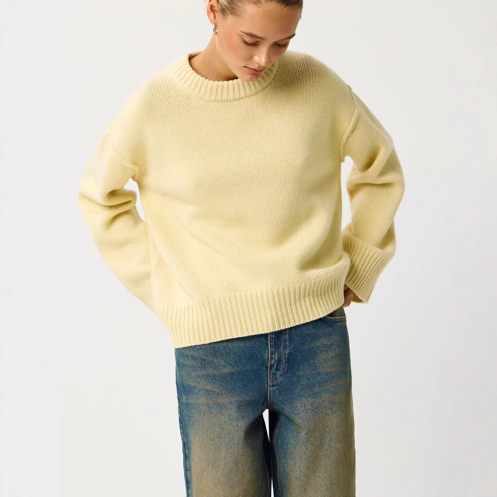 Women's light yellow round-neck knit pullover sweater with ribbed cuffs and hem