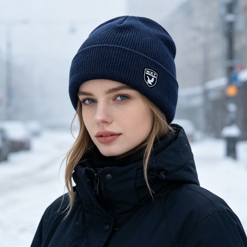 Fleece-lined knit beanie hat, navy blue, ribbed cuff with small front logo patch
