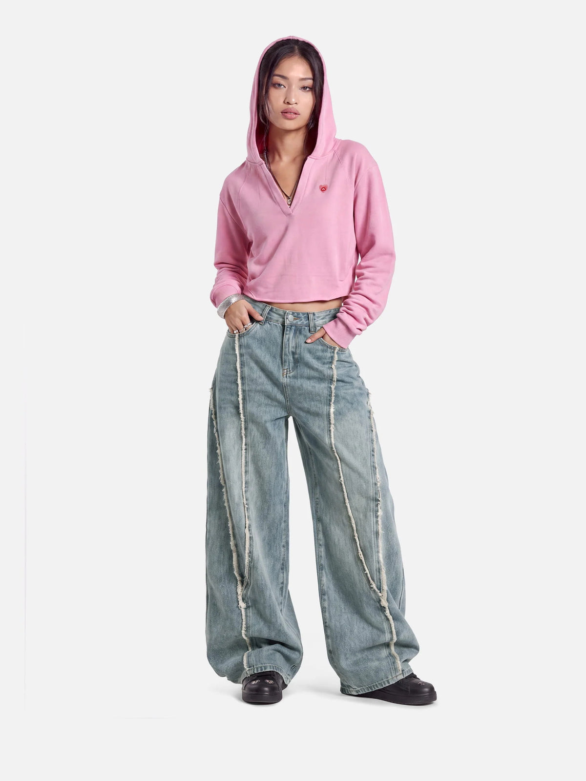 Pink cropped hooded sweatshirt with long sleeves and small chest logo