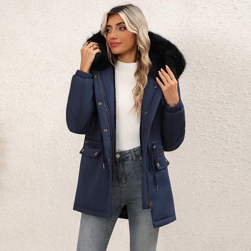 Women's navy blue mid-length hooded parka with faux-fur trimmed hood, button front, drawstring waist pockets