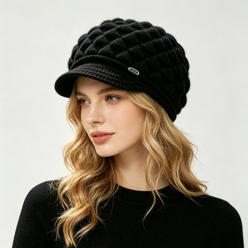 Black fleece-lined knit beanie with quilted texture and folded brim