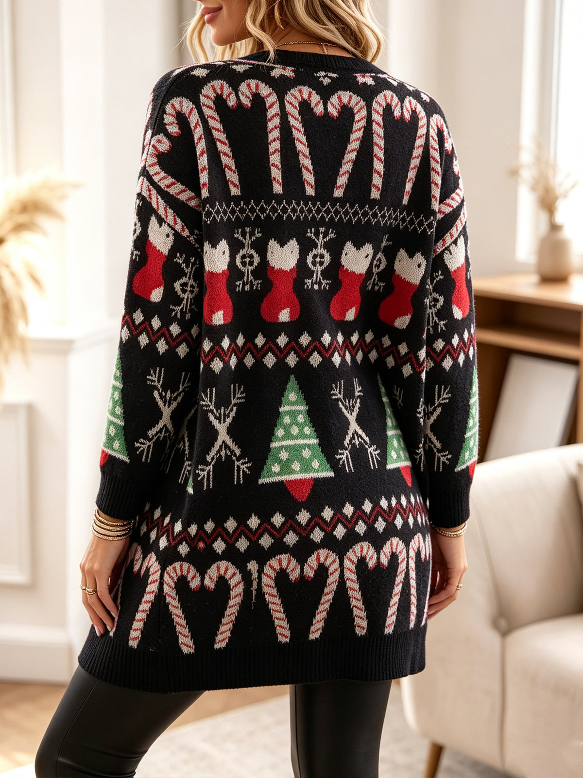Black long cardigan with holiday back pattern of cats, trees, and candy canes