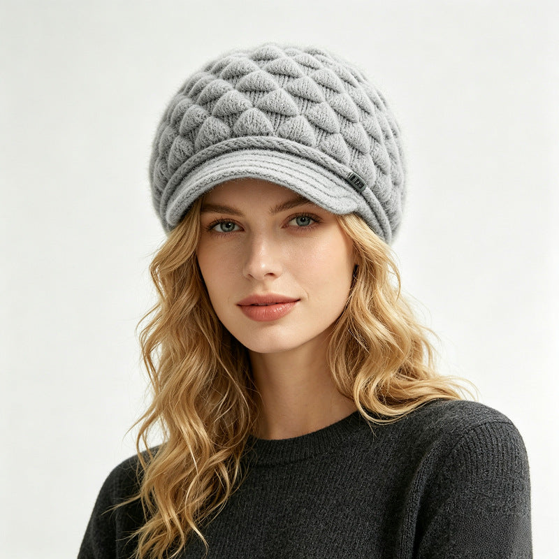 Gray fleece-lined knit beanie with quilted texture and ribbed cuff brim