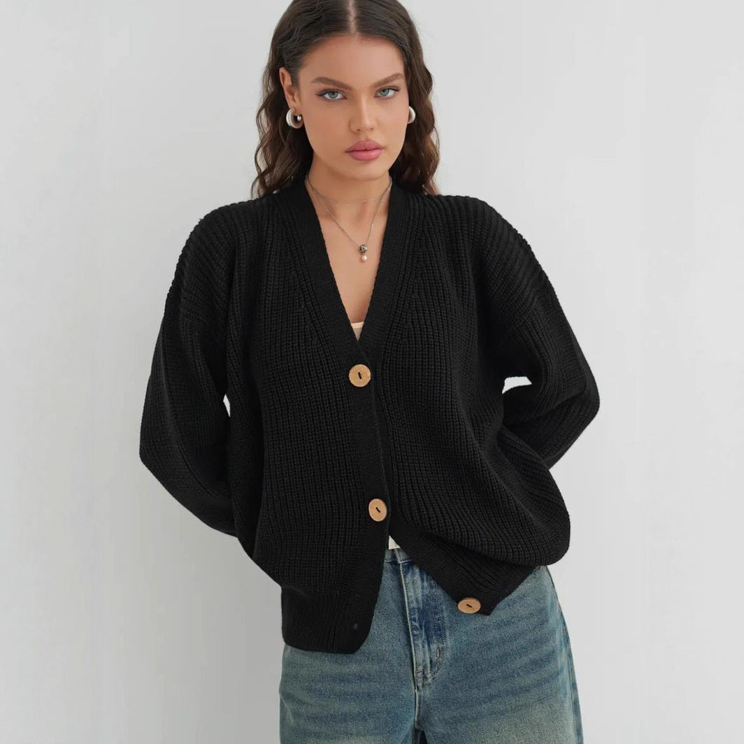 Women’s black chunky-knit cardigan sweater, button-front V-neck, long drop sleeves