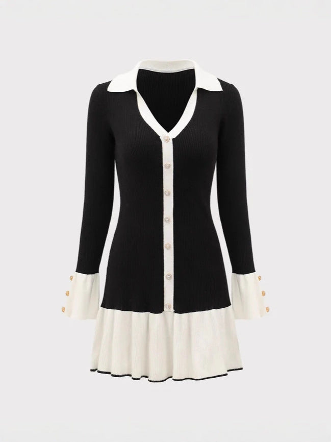 Black knit mini dress front view with long sleeves, V collar, buttons, and ruffle hem