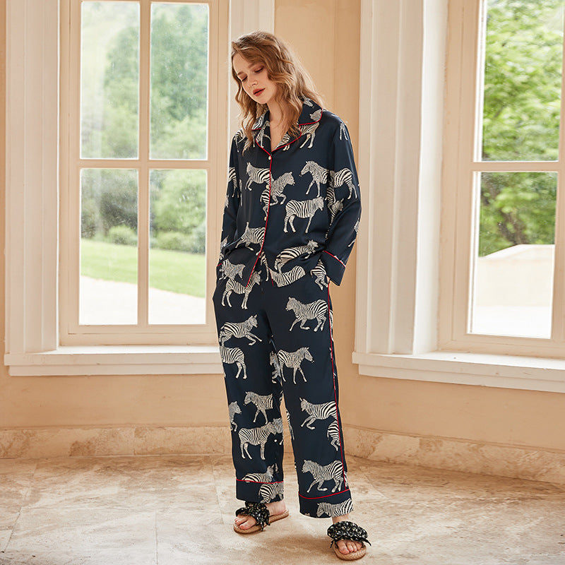 Navy women's zebra print pajama set with long-sleeve button top and straight pants