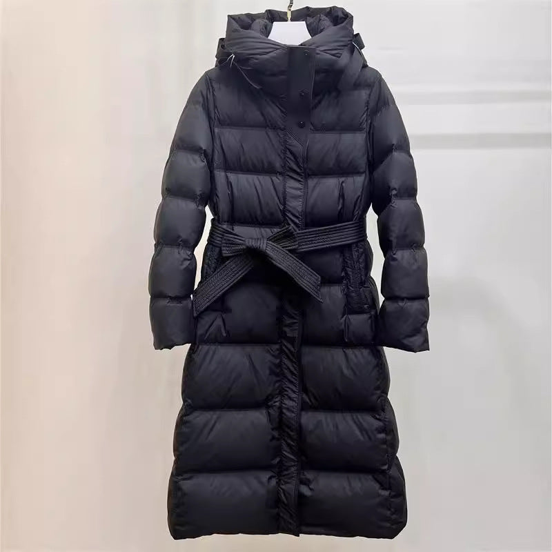 Black long puffer coat with belted waist and hood, glossy quilted down-style padding