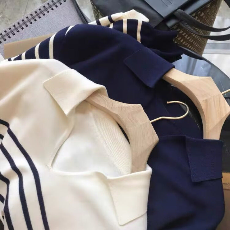 Navy striped V-neck pullover sweater with cream stripes, collared neckline