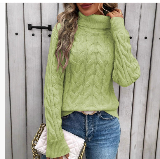 Women's light green cable-knit turtleneck sweater with long sleeves and textured twist pattern