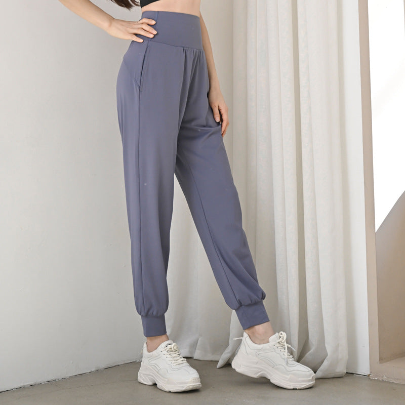 Women's slate-blue athletic jogger pants with elastic waistband and tapered ankle cuffs