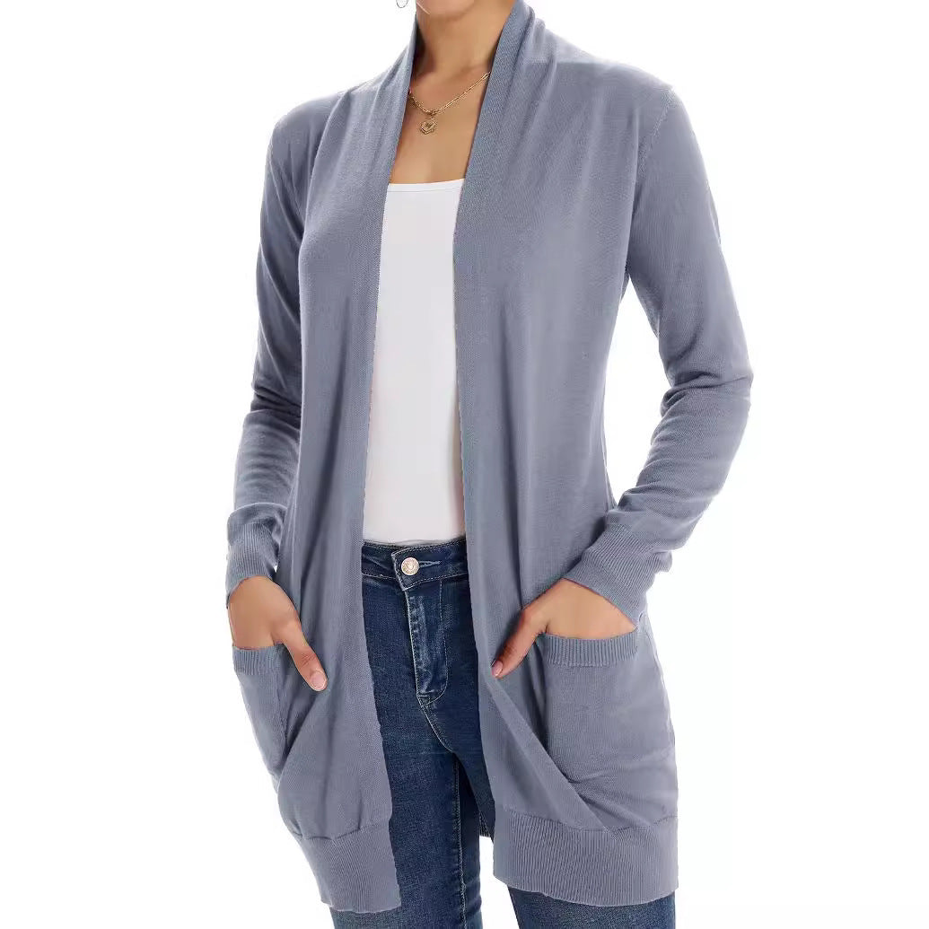 Lightweight light blue cardigan with open front, long sleeves, and patch pockets