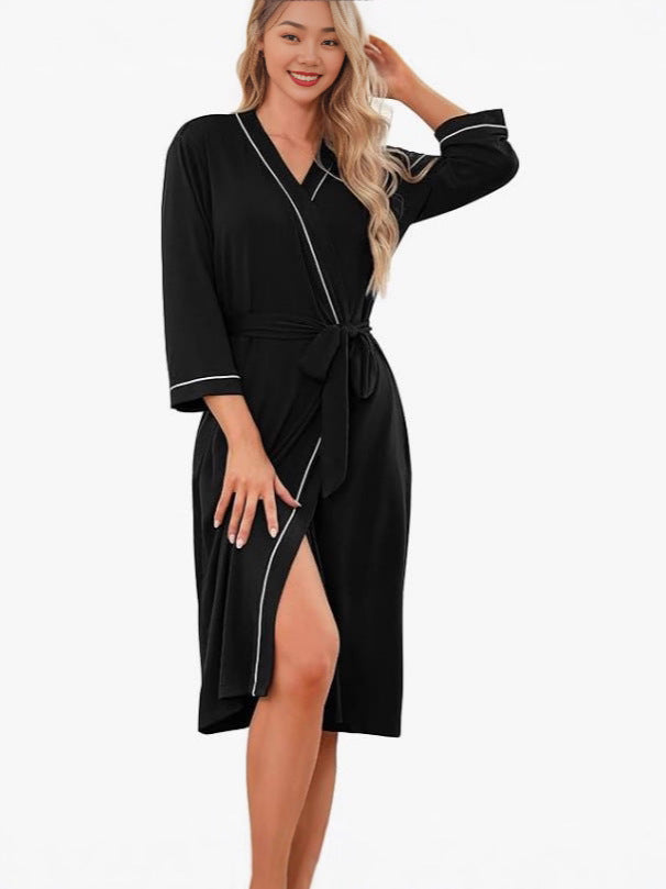 Black kimono robe with V-neck, tie belt, 3/4 sleeves, front slit with light trim