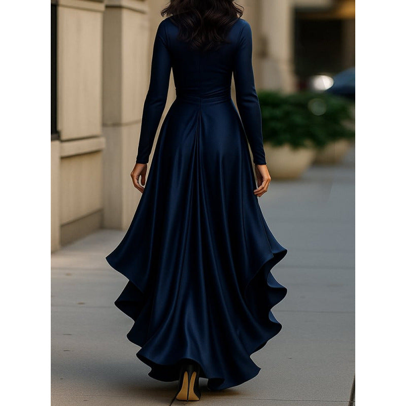 Navy long-sleeve wrap-style dress coat with draped waist and flowing asymmetrical skirt