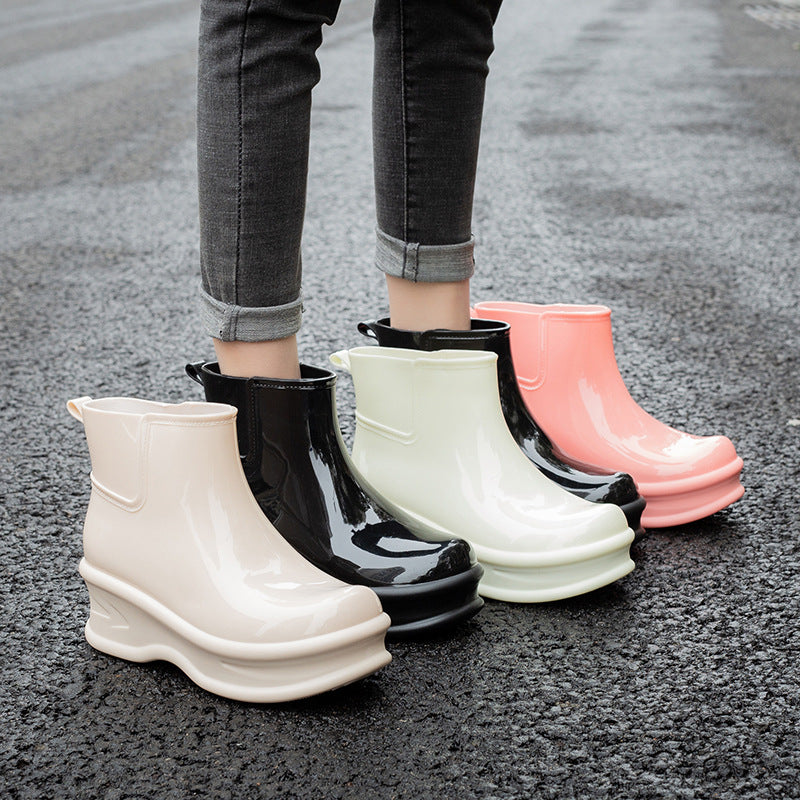 Mid-calf glossy rain boots in assorted colors: white, black, pale green, pink