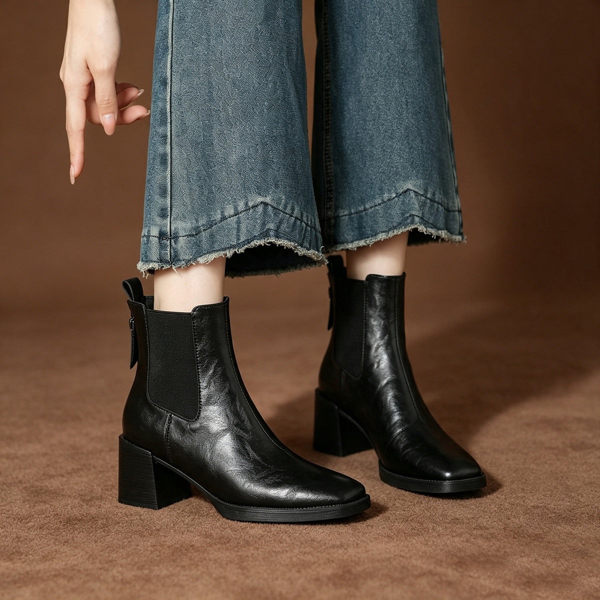 Black Chelsea short boots with square toe, elastic side panels, chunky block heel.