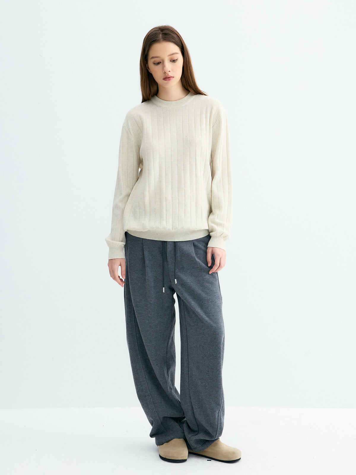 Cream ribbed knit sweater with vertical stripes, round neck, loose casual style.