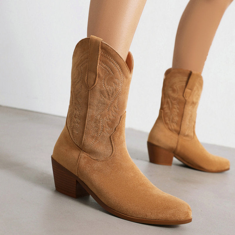 Brown laser-cut western boot with pointed toe and block heel