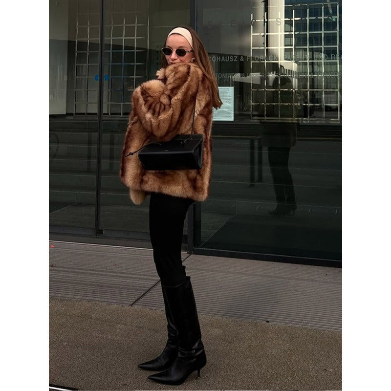 Brown fur jacket with short hem, open front, and plush shag texture