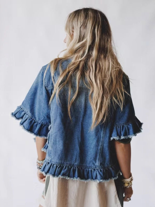 Women's blue denim top back view with ruffle cuffs and frayed hem