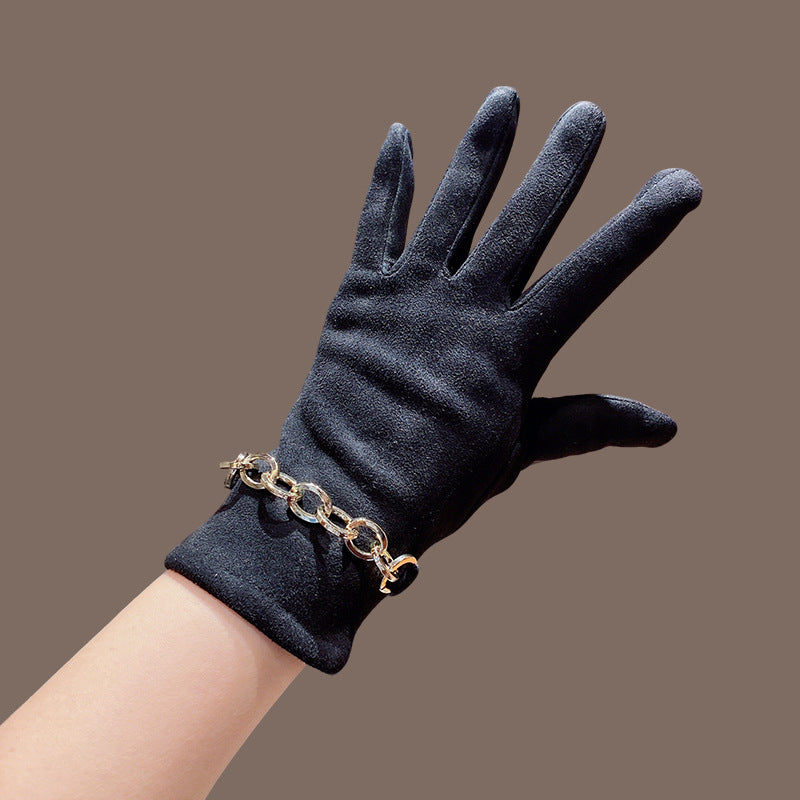 Women’s suede winter gloves, dark blue color, five-finger gloves with gold chain bracelet.