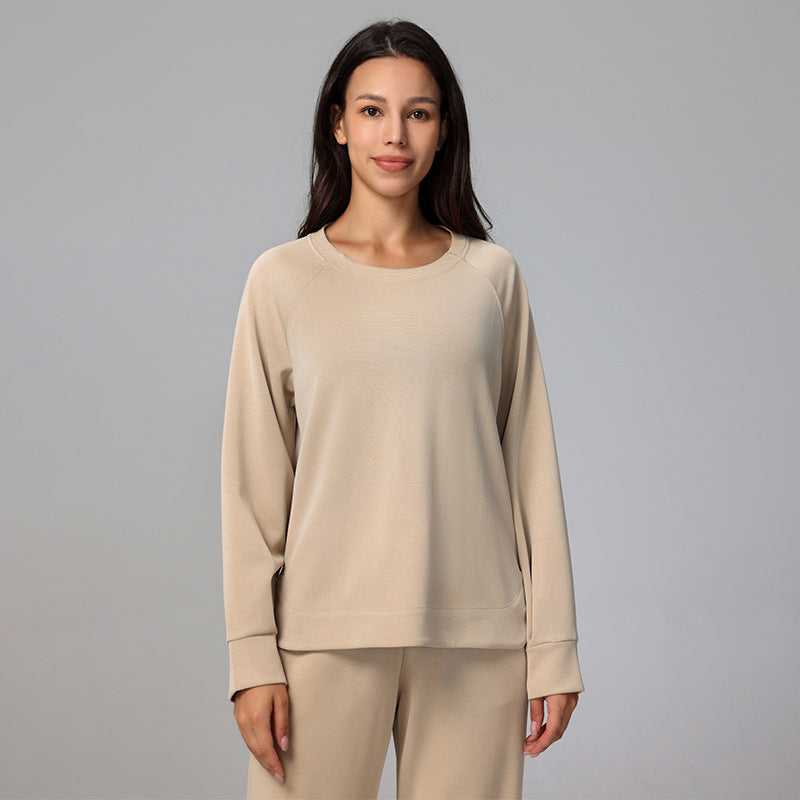 Beige relaxed-fit pullover with a crew neckline and ribbed cuffs