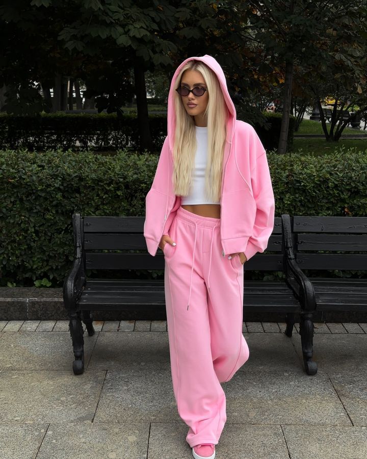Women's pink zip-hooded tracksuit set with matching jogger pants and drawstring waist