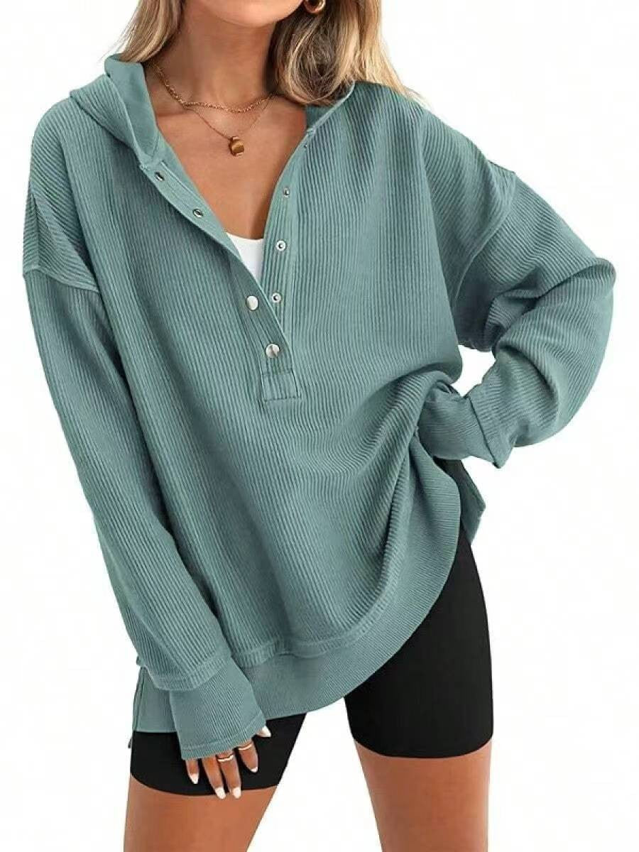 Teal hooded henley sweatshirt detail: button placket and ribbed cuffs