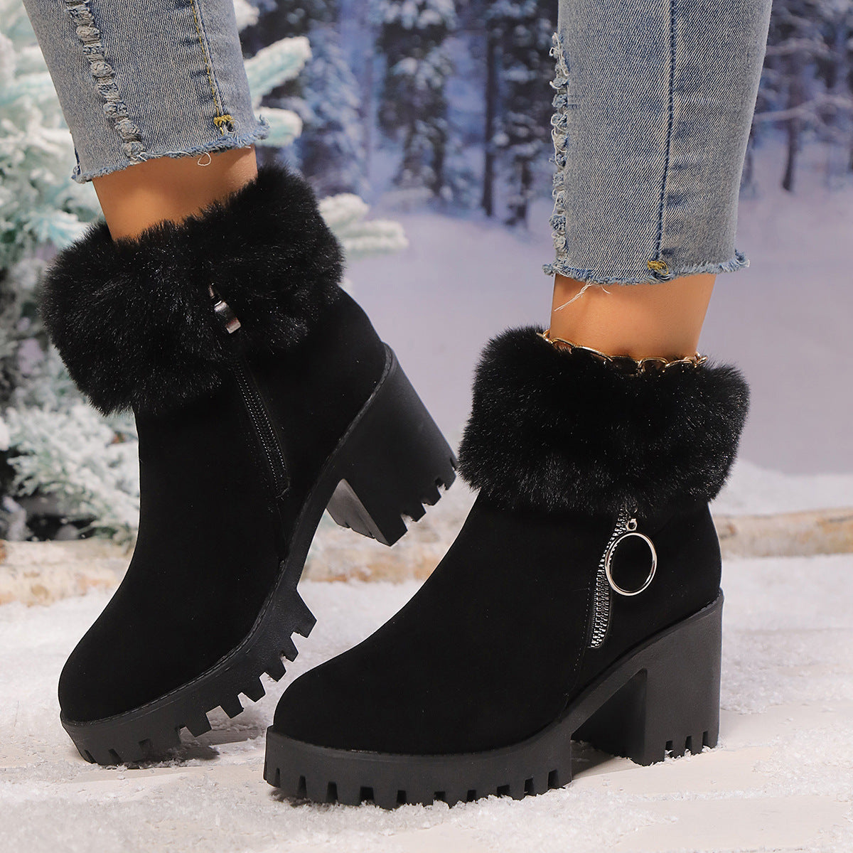 Black suede snow boots with faux fur cuffs and chunky platform heels, side zipper detail.