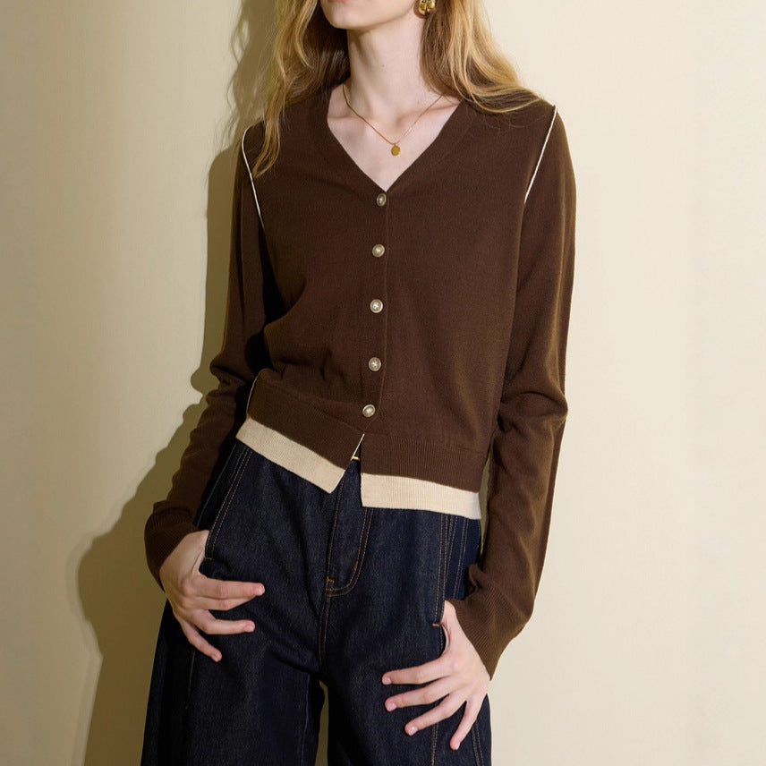 Brown V-neck knit cardigan with button front and cream contrast band at waist