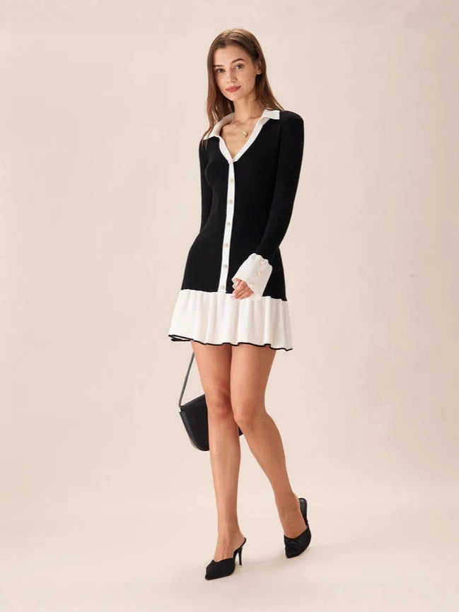 Black and white long-sleeve collared mini dress with button front and ruffle hem, side view