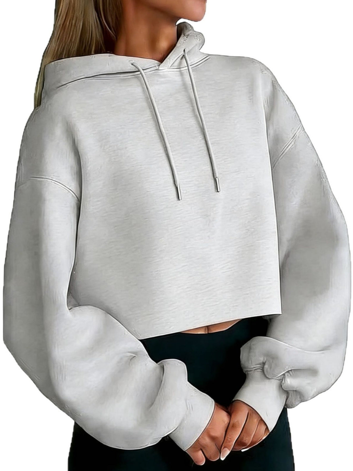 Light gray cropped hooded sweatshirt with drawstring hood and long sleeves