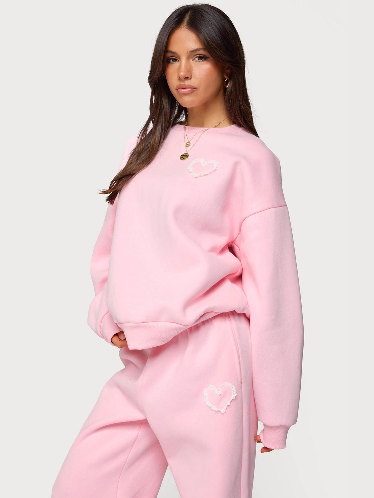 Pink heart-printed sweatshirt with dropped-shoulder look and matching joggers