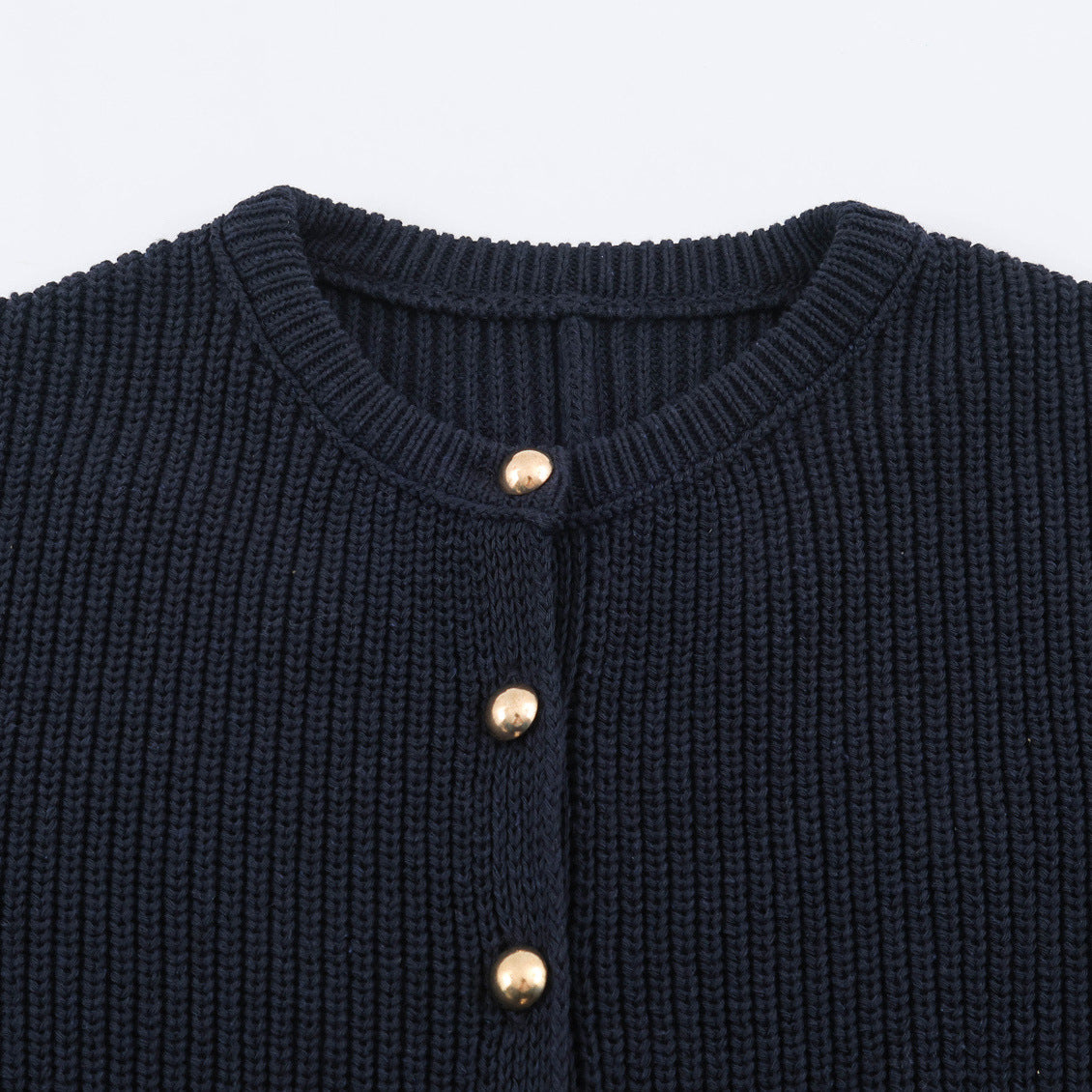 Dark blue knit cardigan close-up with ribbed round neckline and gold-tone buttons