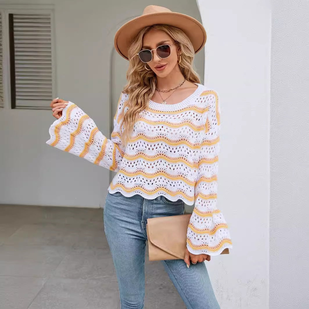 Women’s striped knit pullover sweater with long sleeves, crew neck; white with orange and yellow wavy stripes