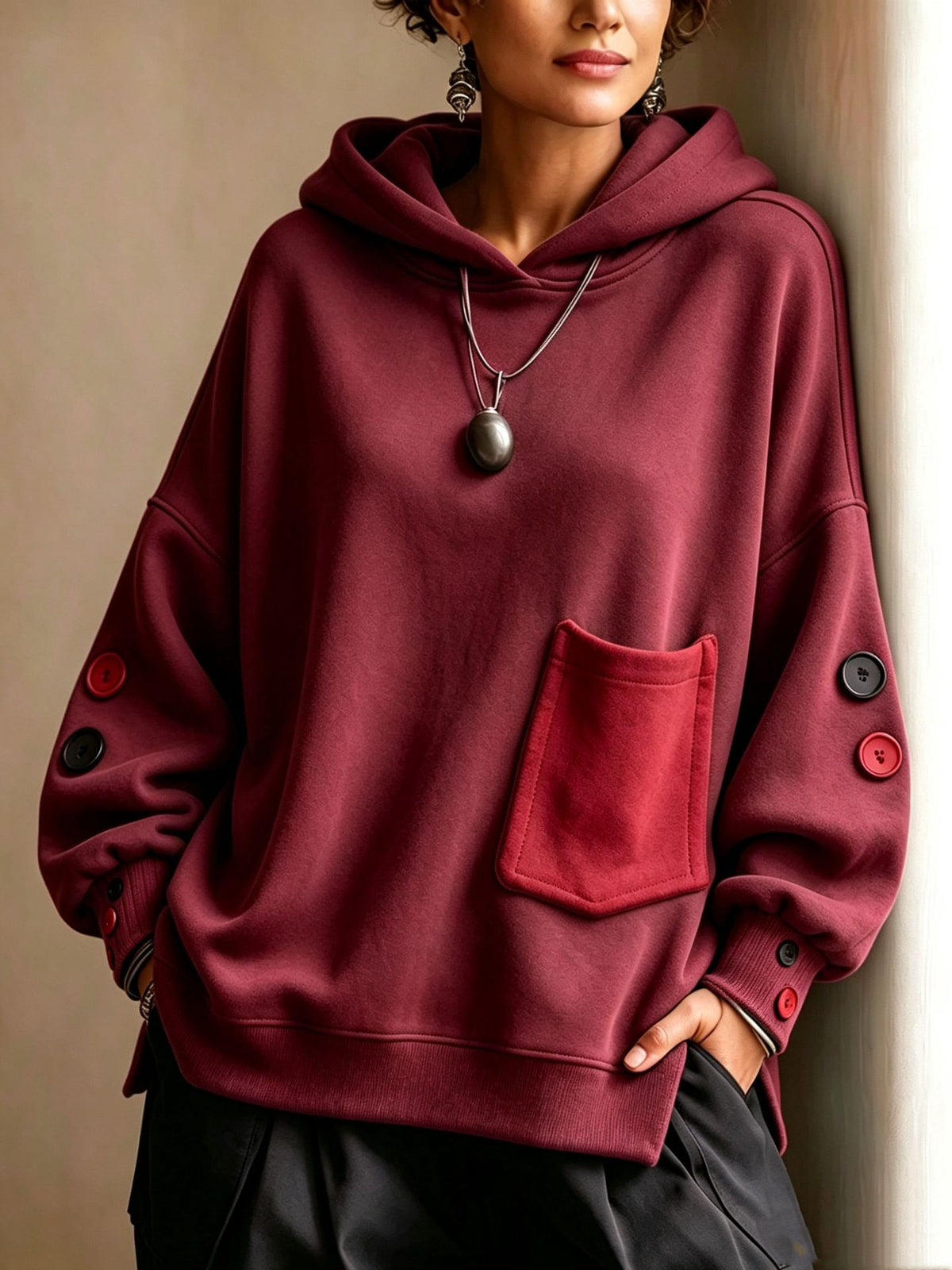 Wine-red pullover hoodie with front kangaroo pocket, hood drawstrings, buttoned sleeve cuffs