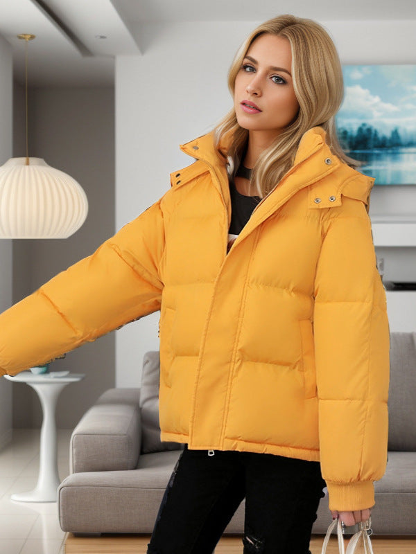 Yellow cotton puffer jacket with zip front, chest pocket, and stand collar