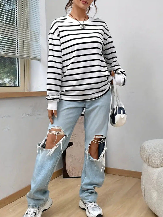 Women's striped sweatshirt back view, white with black horizontal stripes and ribbed hem