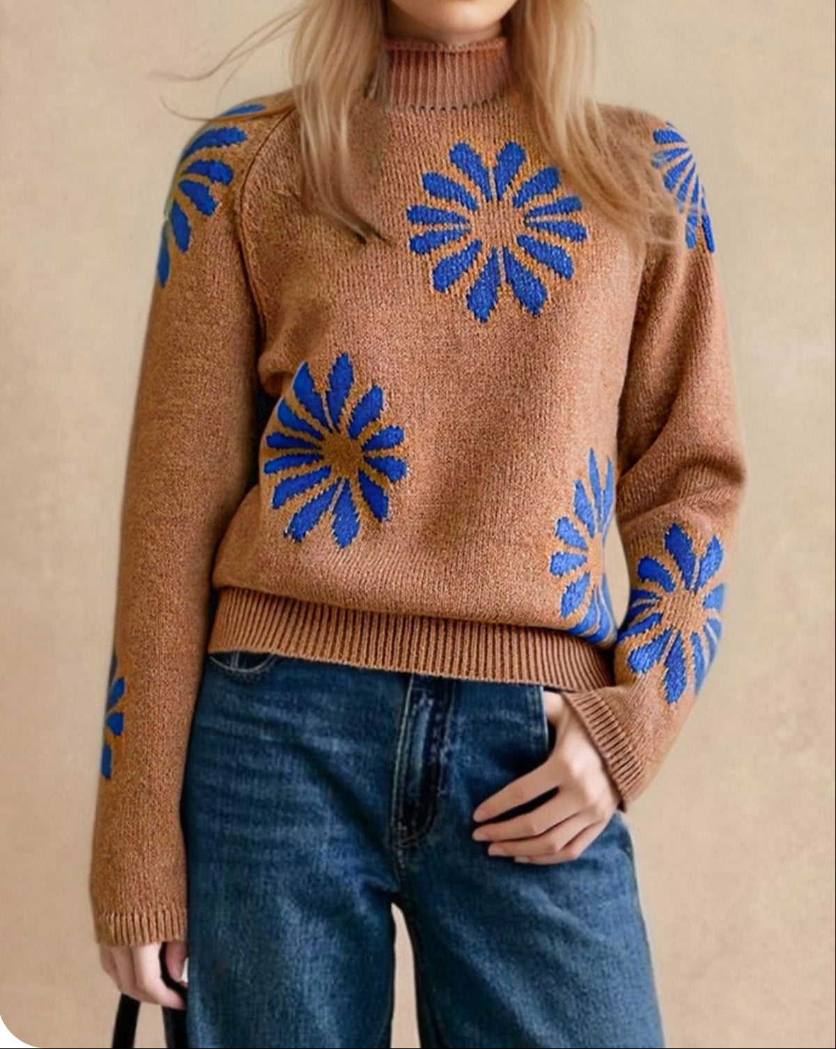 Women's brown round-neck knit sweater with long sleeves and scattered blue floral motifs