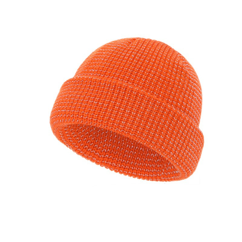 Orange knitted beanie hat with folded cuff, textured stitch knit