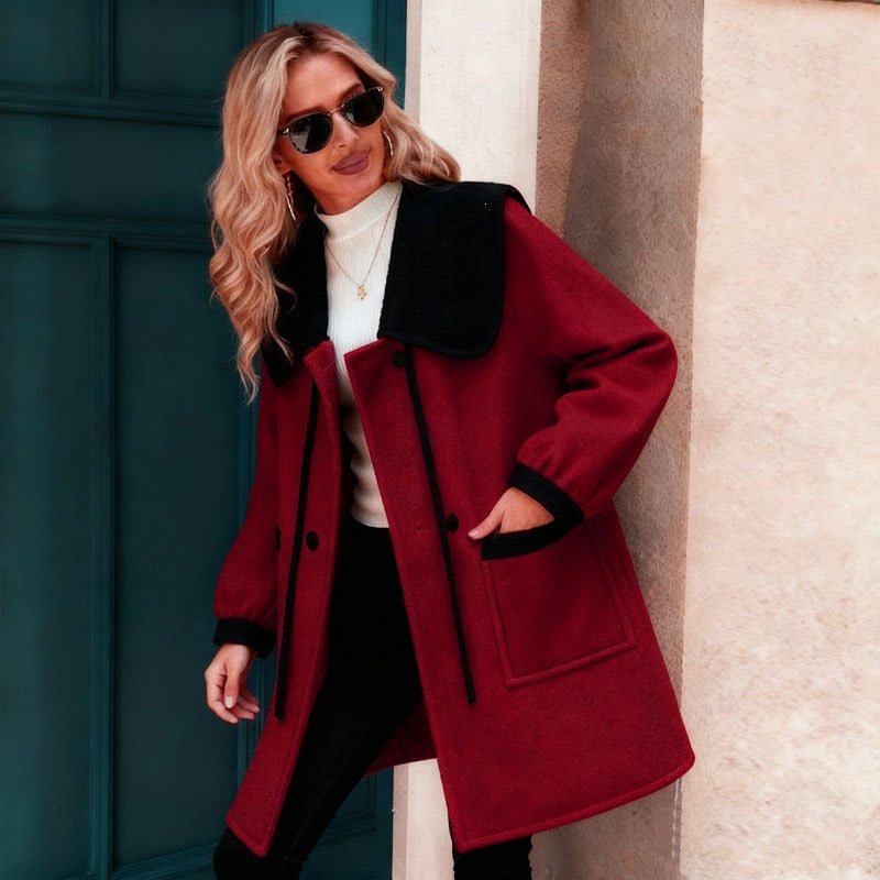 Women’s color-block wool coat with shawl collar, deep red body with black trim and pockets
