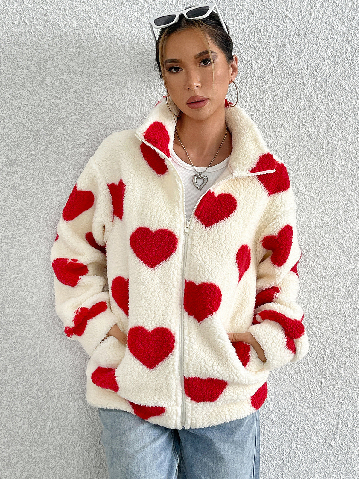Cream plush zip-up cardigan with red heart pattern, long sleeves, front zipper closure