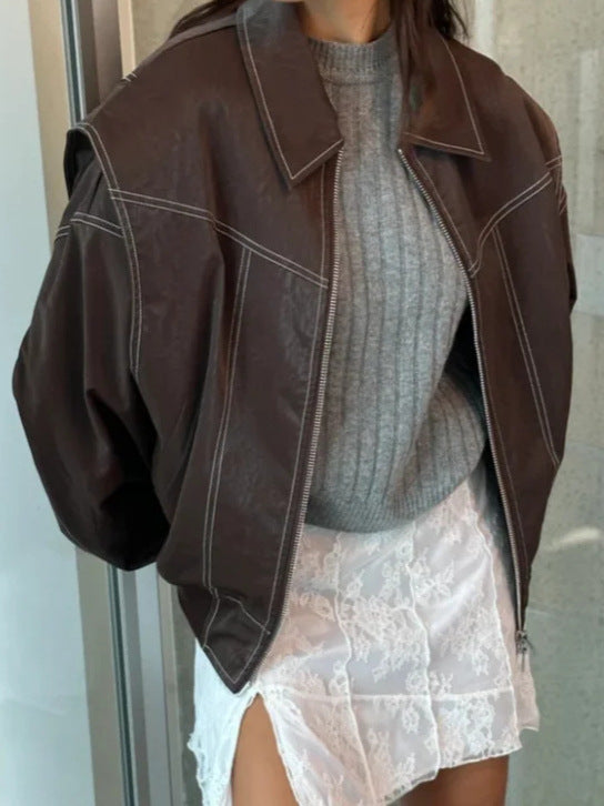 Brown faux leather moto jacket with contrast stitching, zip front, oversized cropped style