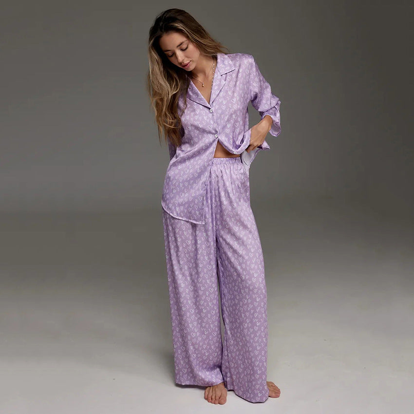 Women's lavender printed pajama set with long-sleeve button shirt and wide-leg trousers.